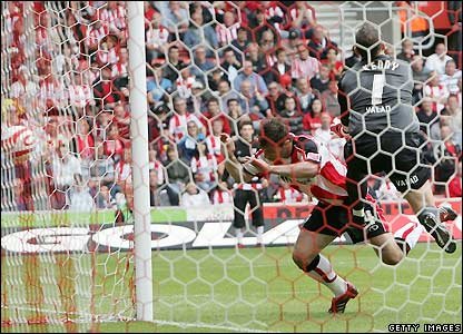 Stephen Quinn opens the scoring for the Blades but Marek Saganowski stoops to head the hosts level shortly before the interval.jpg